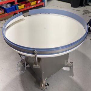 ICP rotary accumulation table positioned at the end of a packaging conveyor line for efficient product collection.